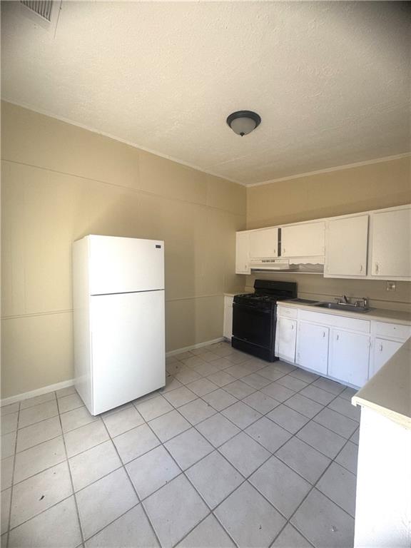 2126 Hanfred Court Tucker, GA 30084 - Photo 6 of 9 a kitchen with a sink and a refrigerator