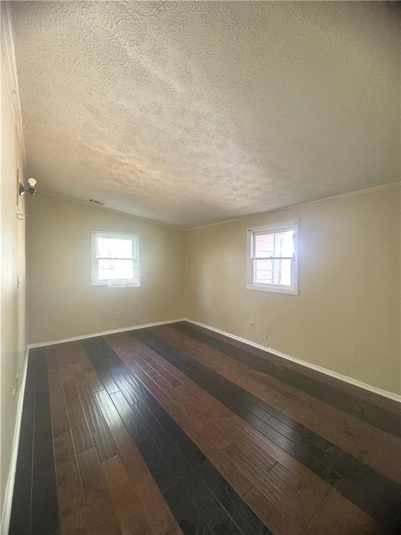 2126 Hanfred Court Tucker, GA 30084 - Photo 9 of 9 an empty room with wooden floor and windows