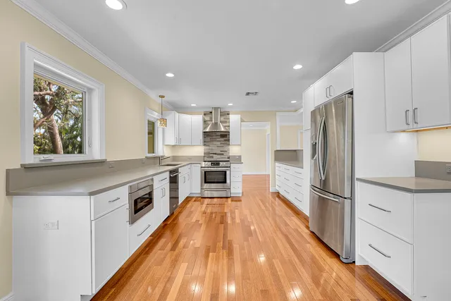a view of kitchen with wooden floor