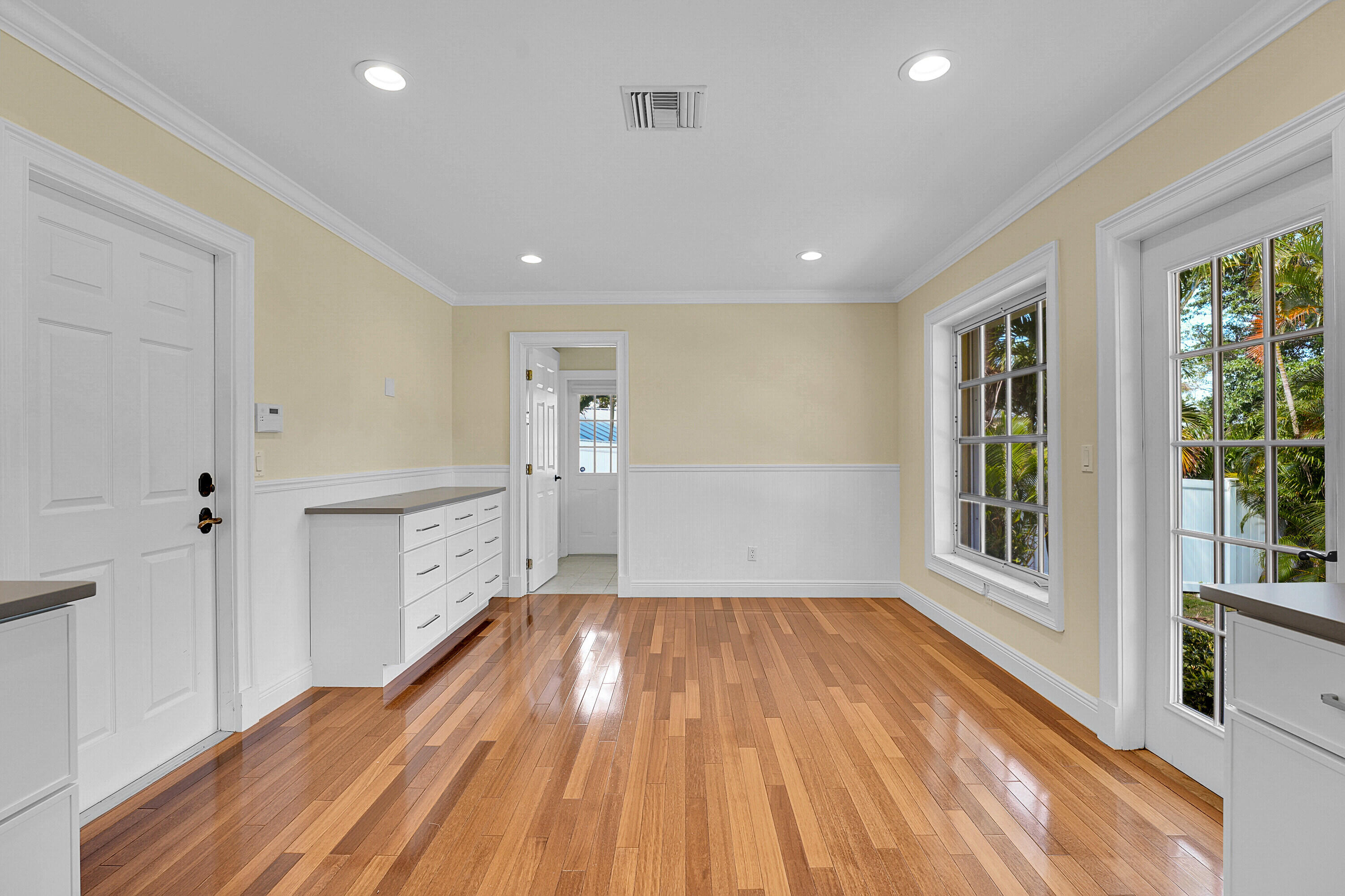 10 Middle Road Sewall's Point, FL 34996 - Photo 13 of 28 a view of empty room with wooden floor and fan