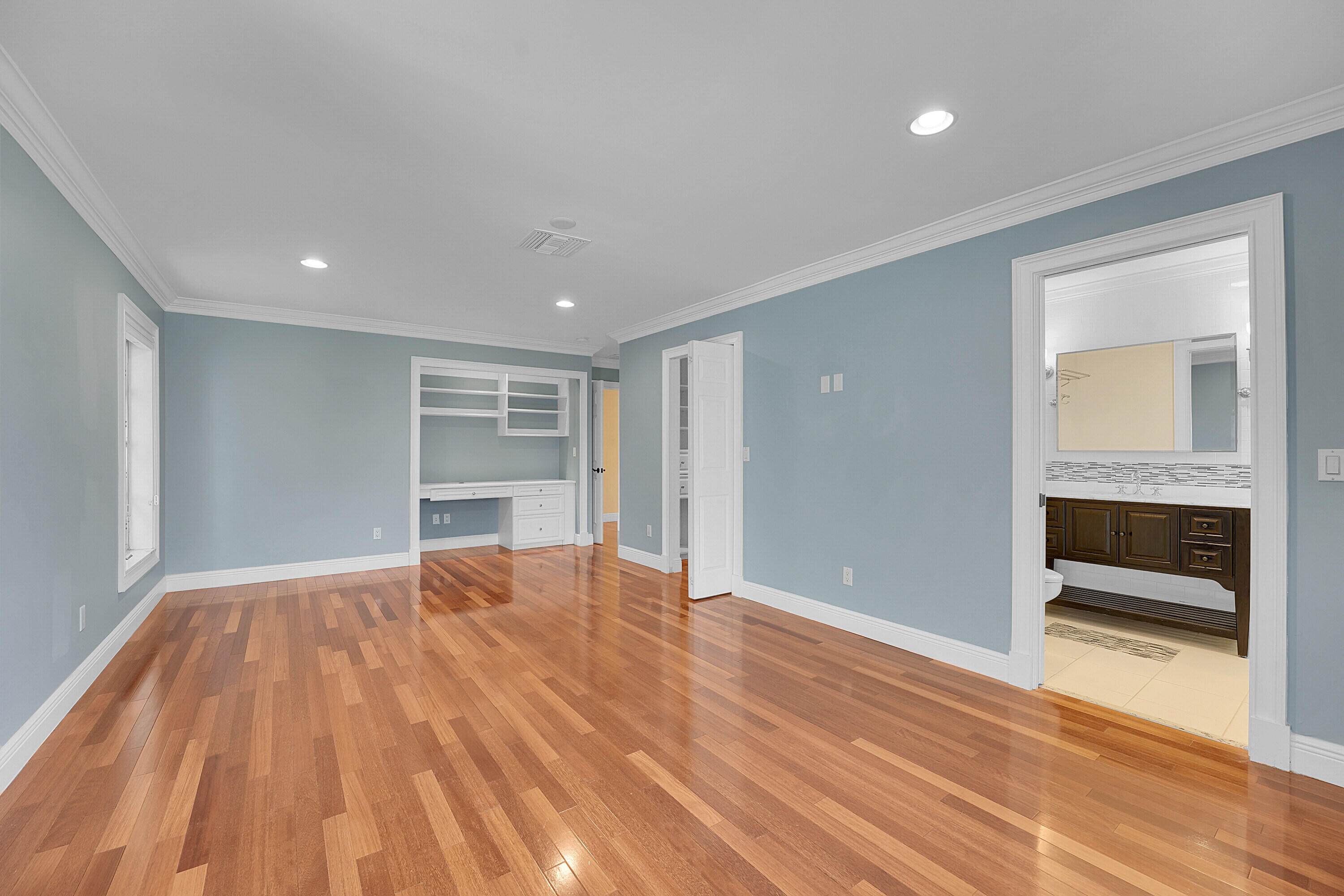 10 Middle Road Sewall's Point, FL 34996 - Photo 16 of 28 a view of an empty room with wooden floor closet and fire place
