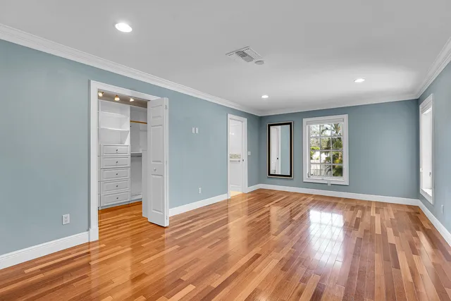 a room with a dresser and a window