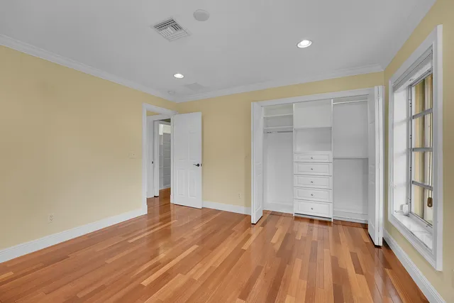 a view of a house with a yard and tree s