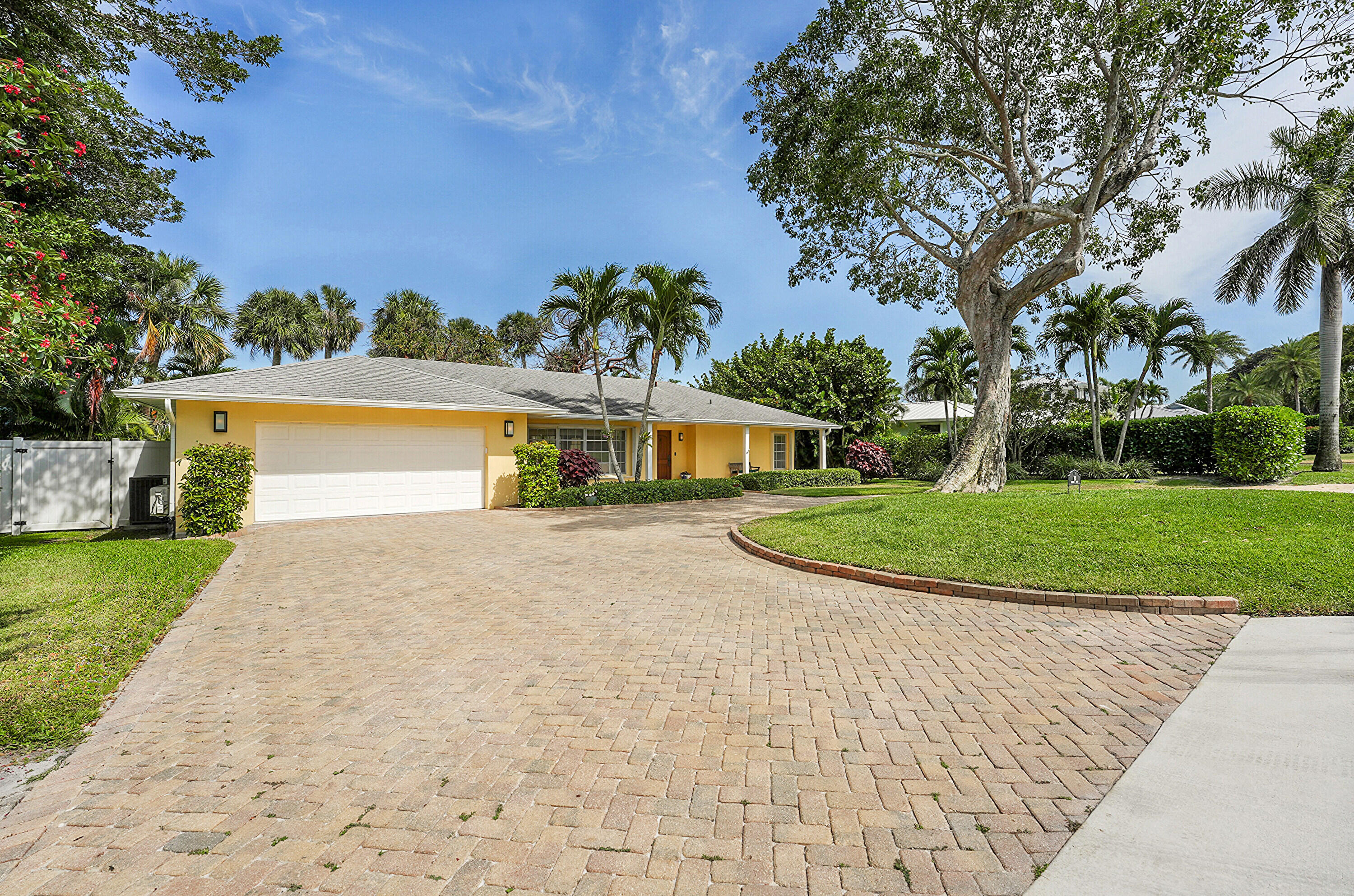 10 Middle Road Sewall's Point, FL 34996 - Photo 4 of 28 a view of a house with a yard and a large tree