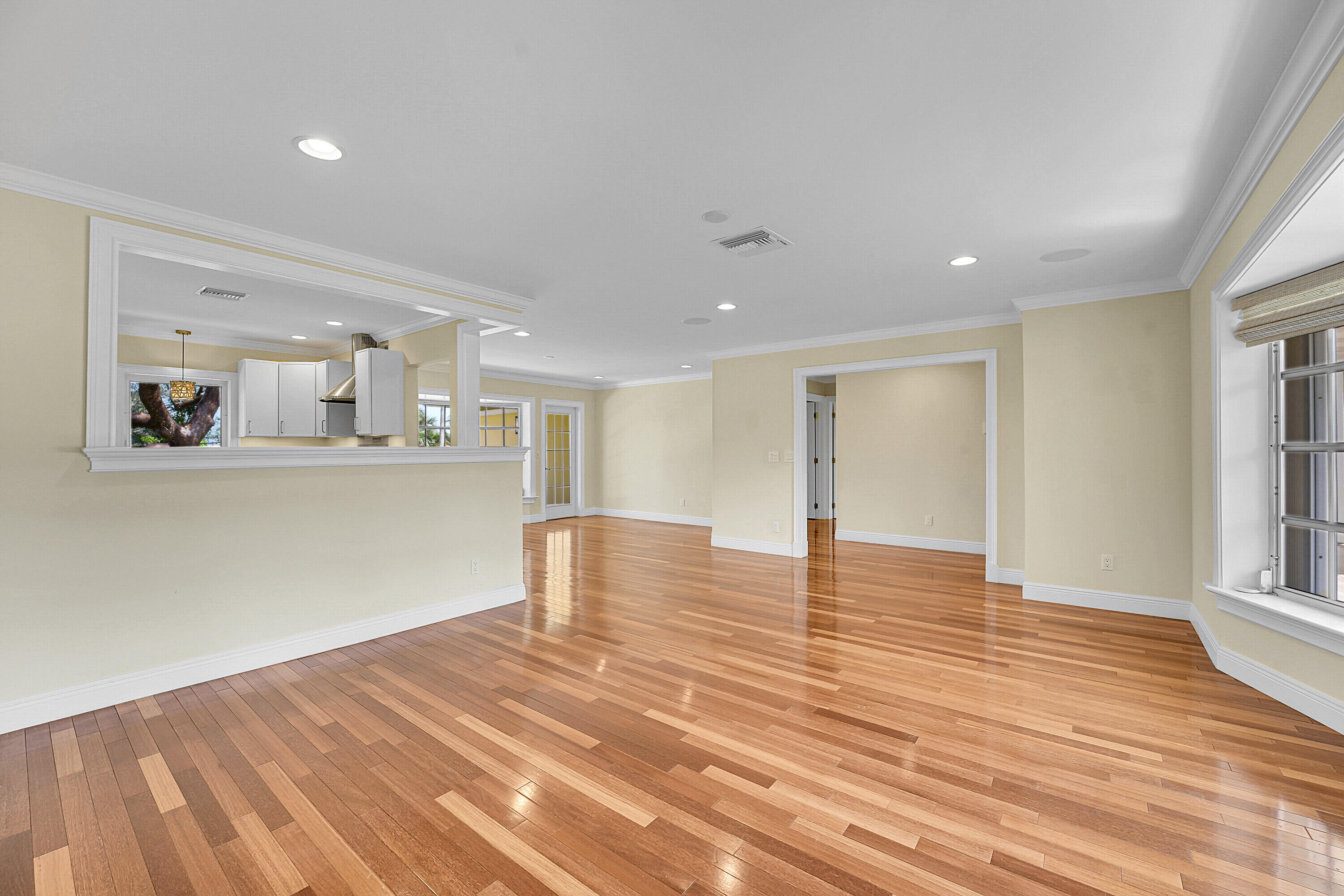10 Middle Road Sewall's Point, FL 34996 - Photo 8 of 28 a view of kitchen and empty room with wooden floor