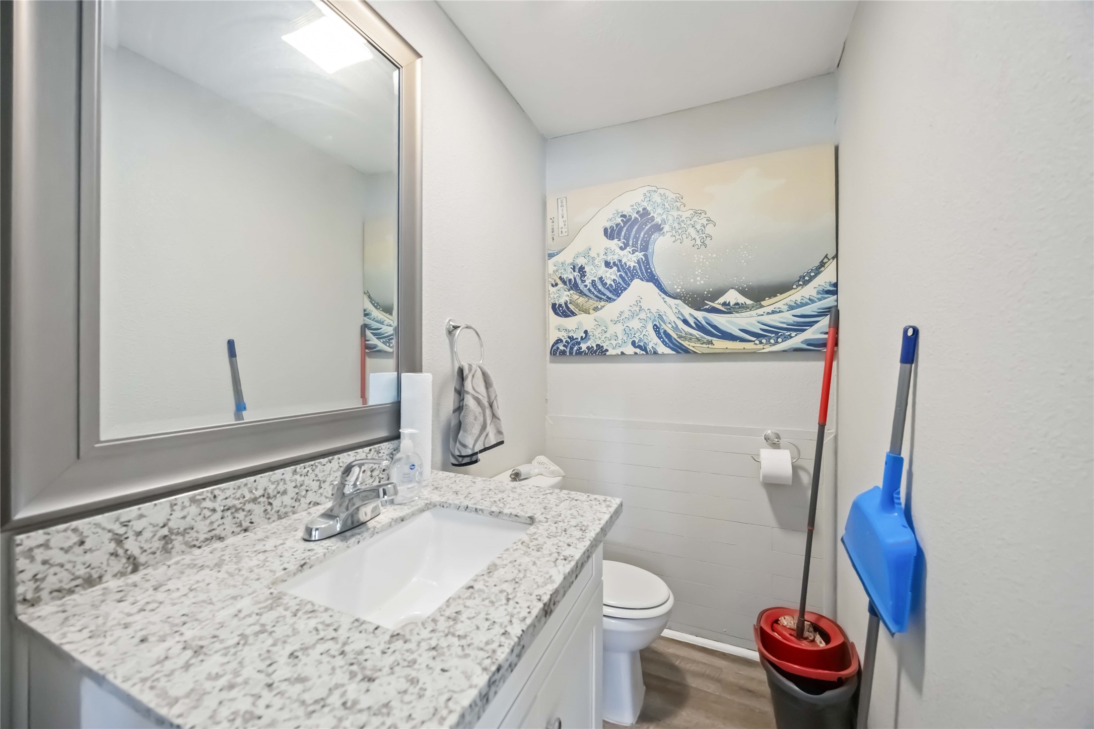 3710 Bremond Street Houston, TX 77004 - Photo 12 of 30 a bathroom with a granite countertop sink and a toilet