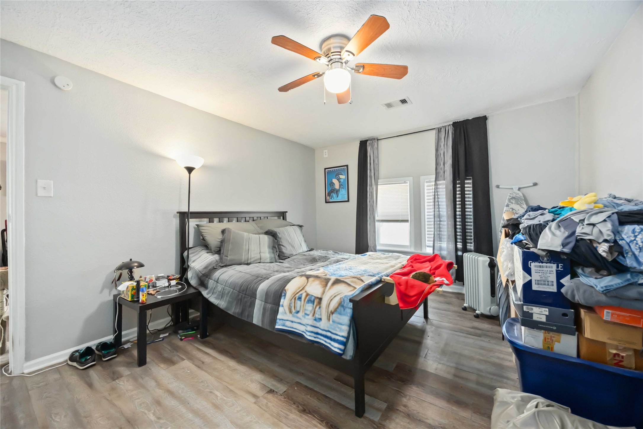 3710 Bremond Street Houston, TX 77004 - Photo 14 of 30 a bedroom with bed and a chandelier