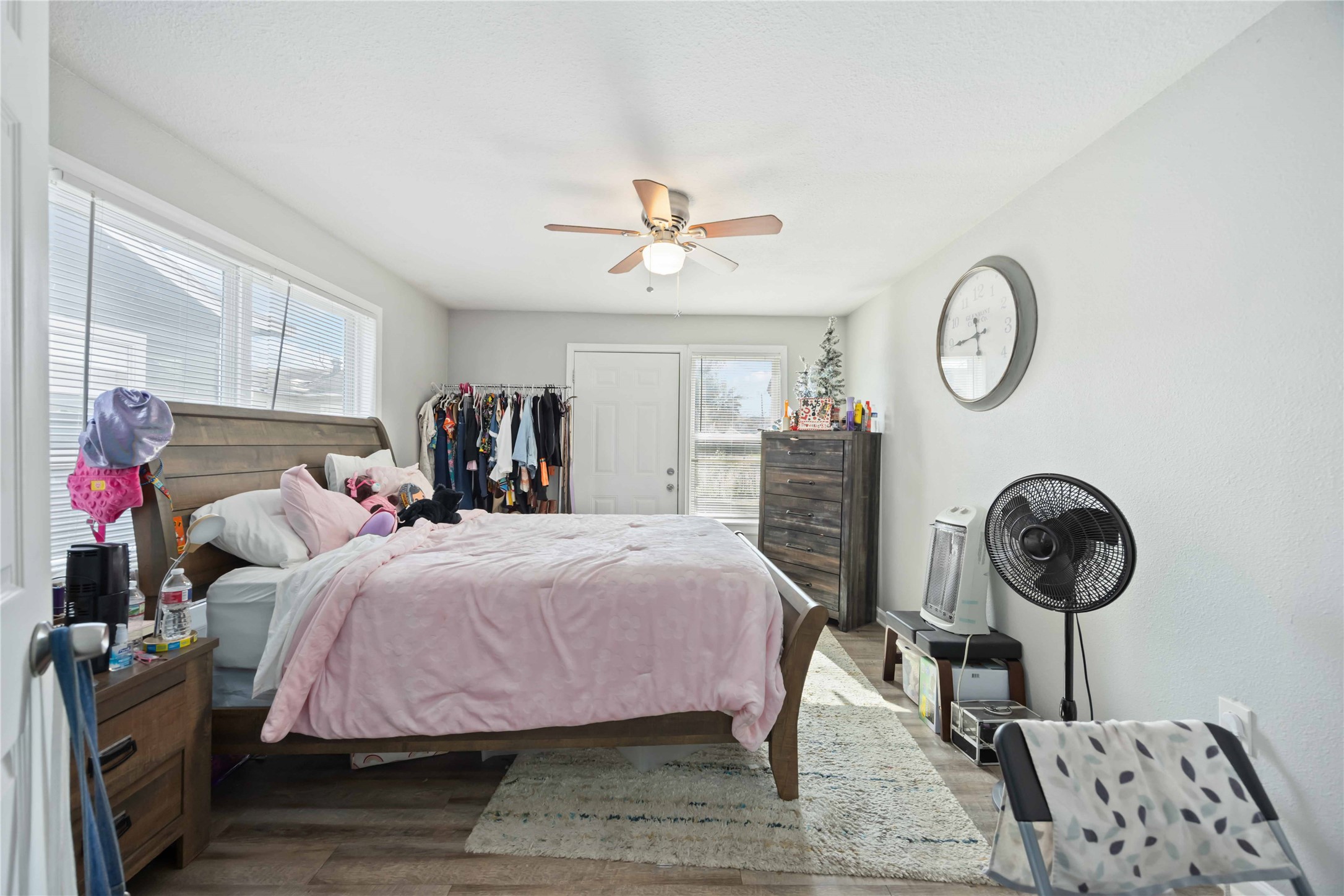 3710 Bremond Street Houston, TX 77004 - Photo 26 of 30 a bedroom with a bed and a chandelier