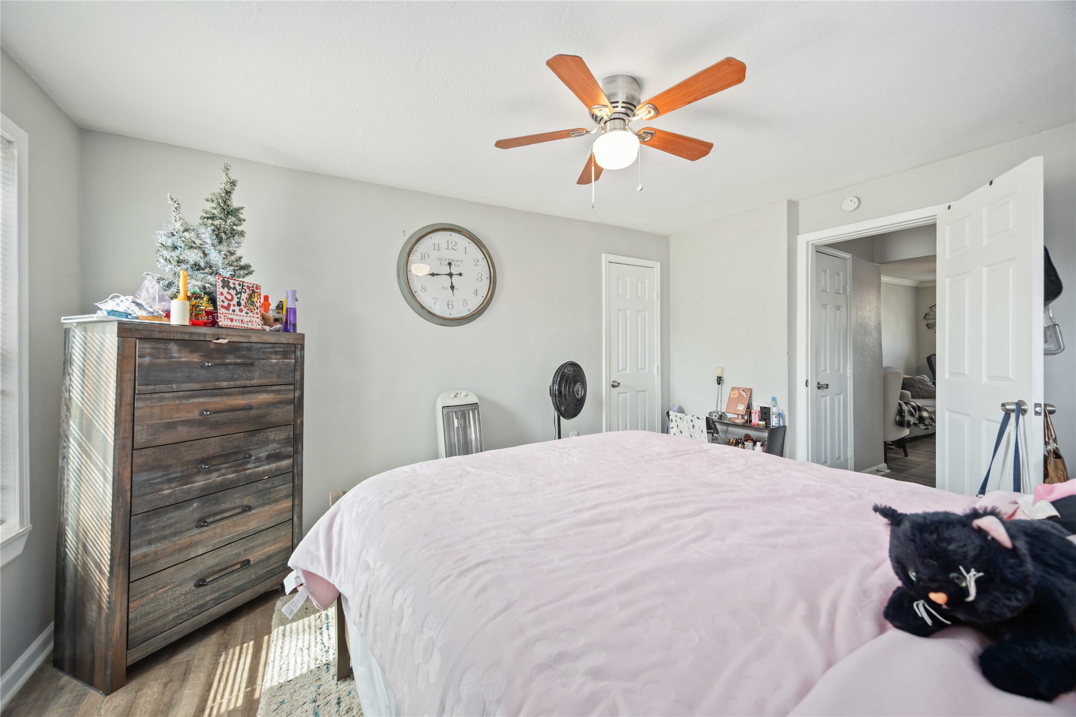 3710 Bremond Street Houston, TX 77004 - Photo 27 of 30 a bedroom with a bed and a chandelier