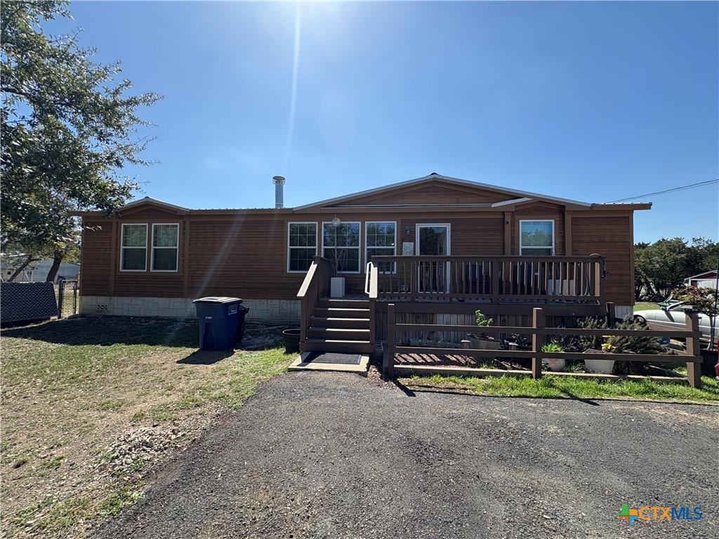 371 Moosehead Road Spring Branch, TX 78070 - Photo 1 of 17 a view of a house with backyard and sitting area