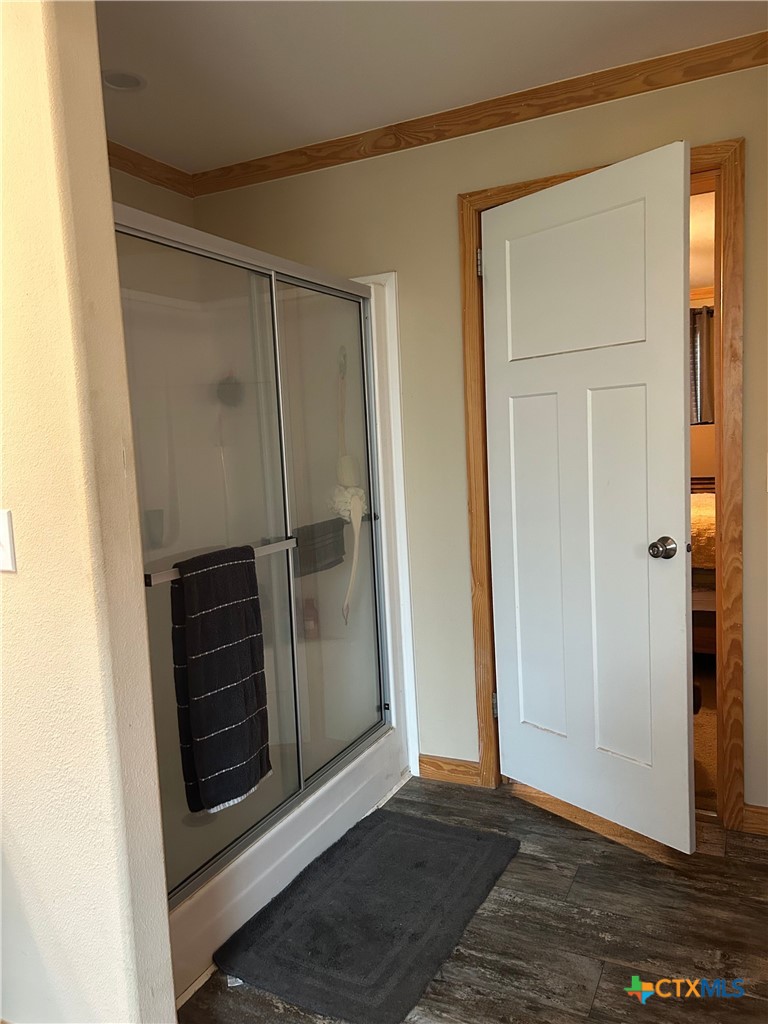 371 Moosehead Road Spring Branch, TX 78070 - Photo 15 of 17 a view of a closet area with wooden floor