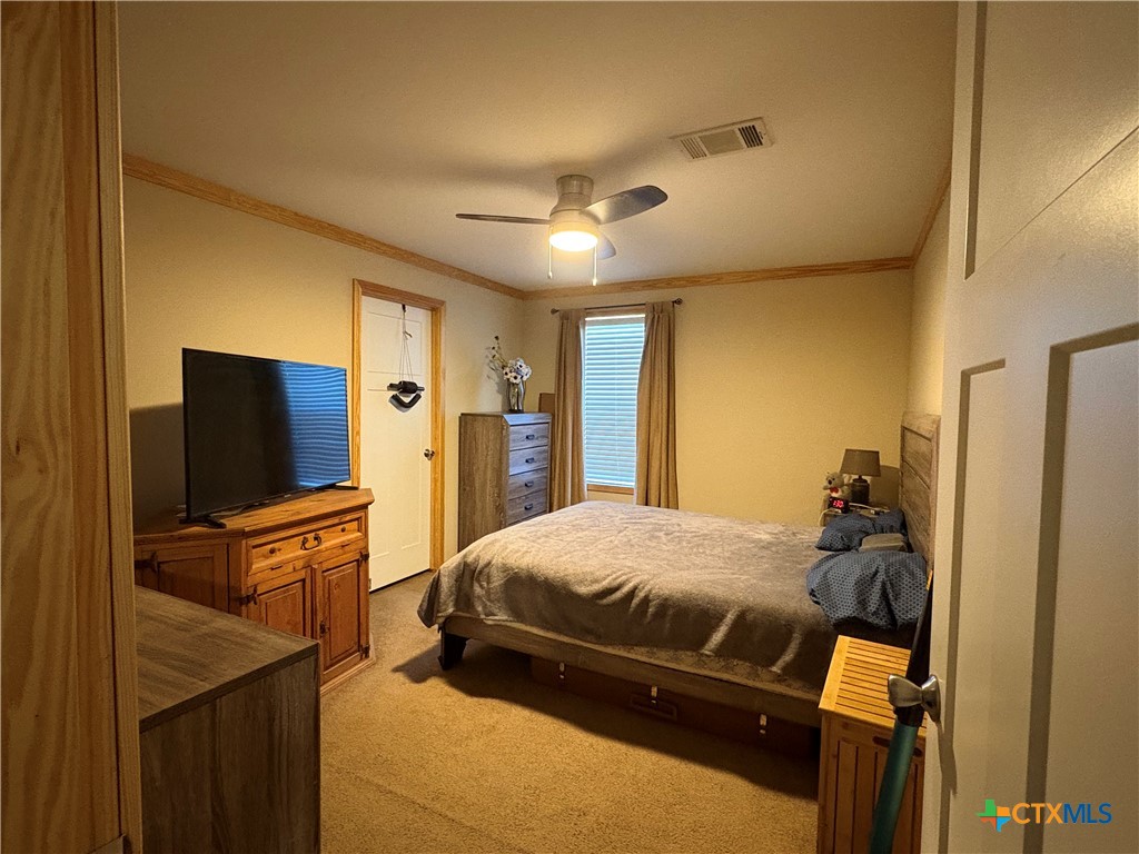 371 Moosehead Road Spring Branch, TX 78070 - Photo 16 of 17 a bedroom with a bed and furniture