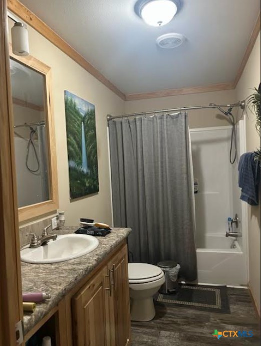 371 Moosehead Road Spring Branch, TX 78070 - Photo 17 of 17 a bathroom with a granite countertop sink toilet and mirror