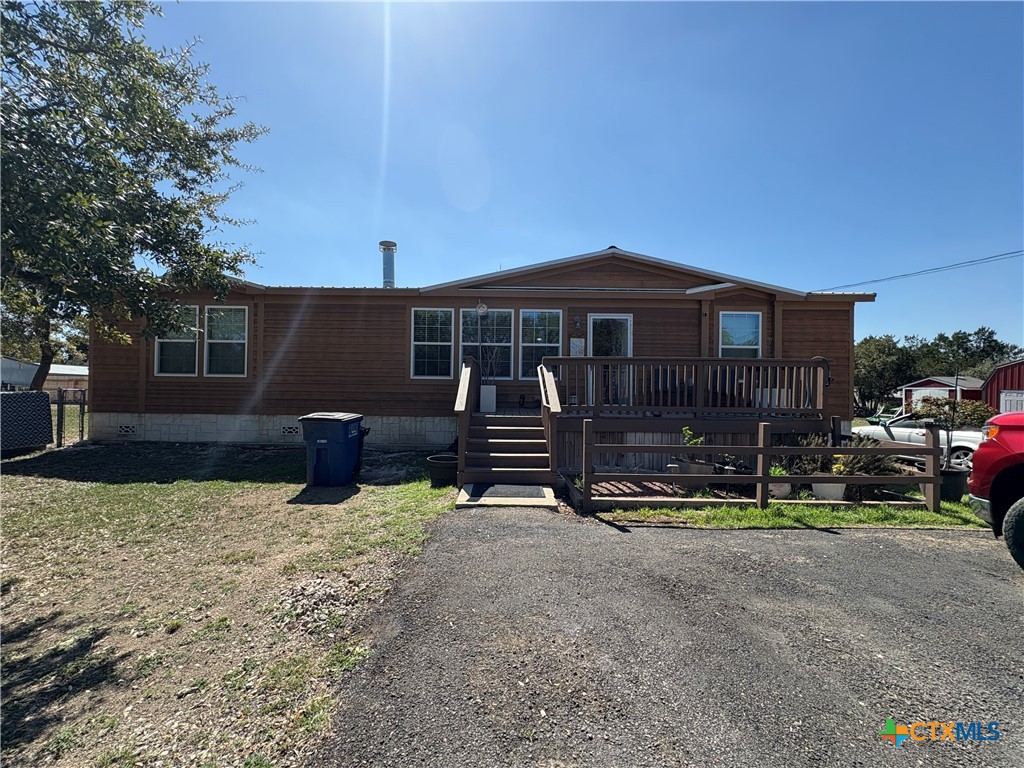 371 Moosehead Road Spring Branch, TX 78070 - Photo 2 of 17 a view of house with outdoor space and parking