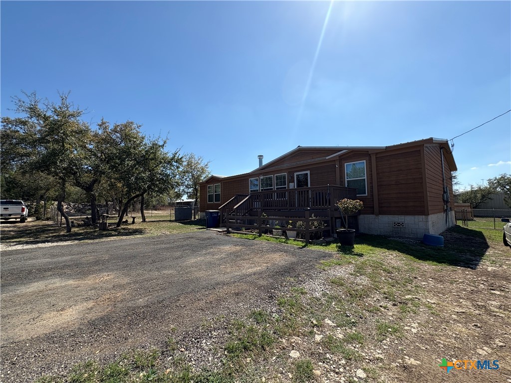 371 Moosehead Road Spring Branch, TX 78070 - Photo 5 of 17 a view of a house with a yard
