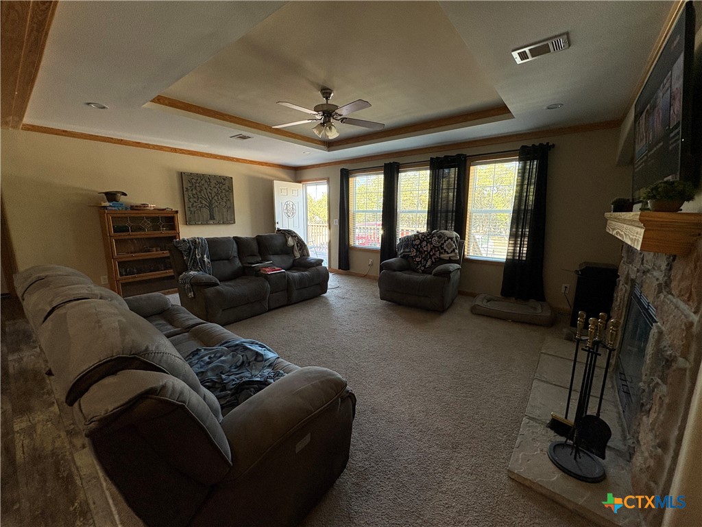 371 Moosehead Road Spring Branch, TX 78070 - Photo 9 of 17 a living room with furniture gym equipment and a large window