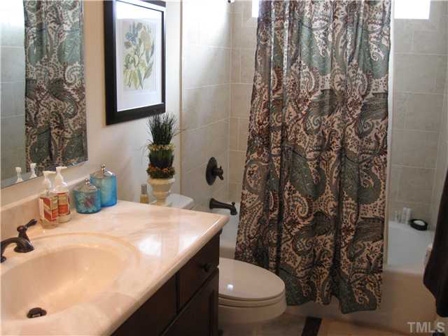 706 Tower Street Raleigh, NC 27607 - Photo 19 of 23 a bathroom with a sink toilet and shower