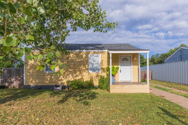 a house view with a garden space