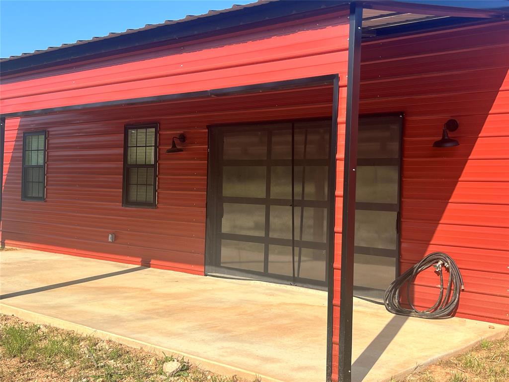a view of a door and an empty room