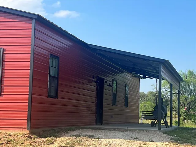 a view of a house with a large window