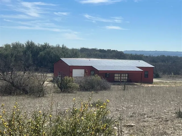 a view of a big yard with an outdoor space