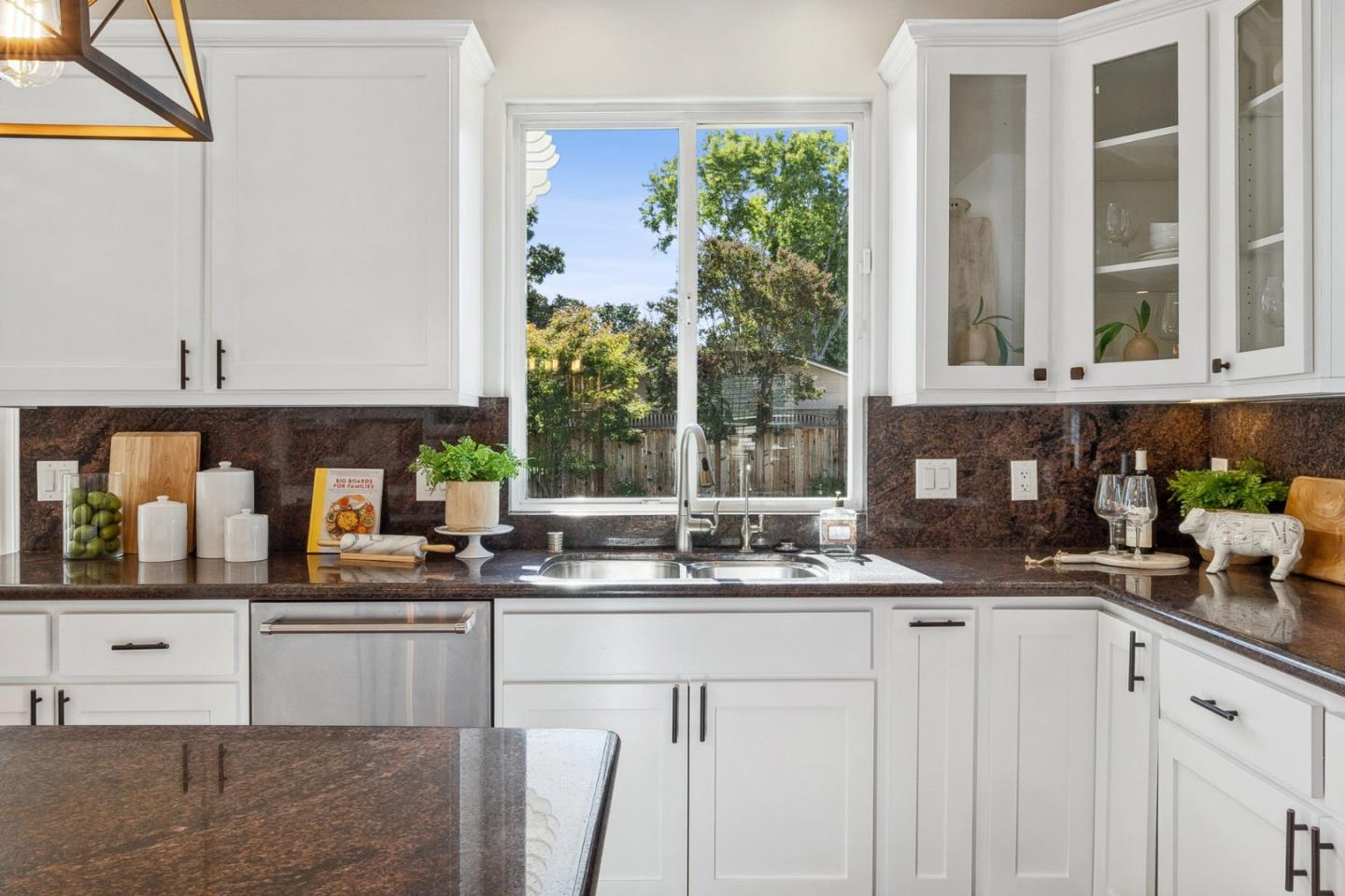14574 Nelson Way San Jose, CA 95124 - Photo 17 of 62 a kitchen with stainless steel appliances granite countertop white cabinets and a window