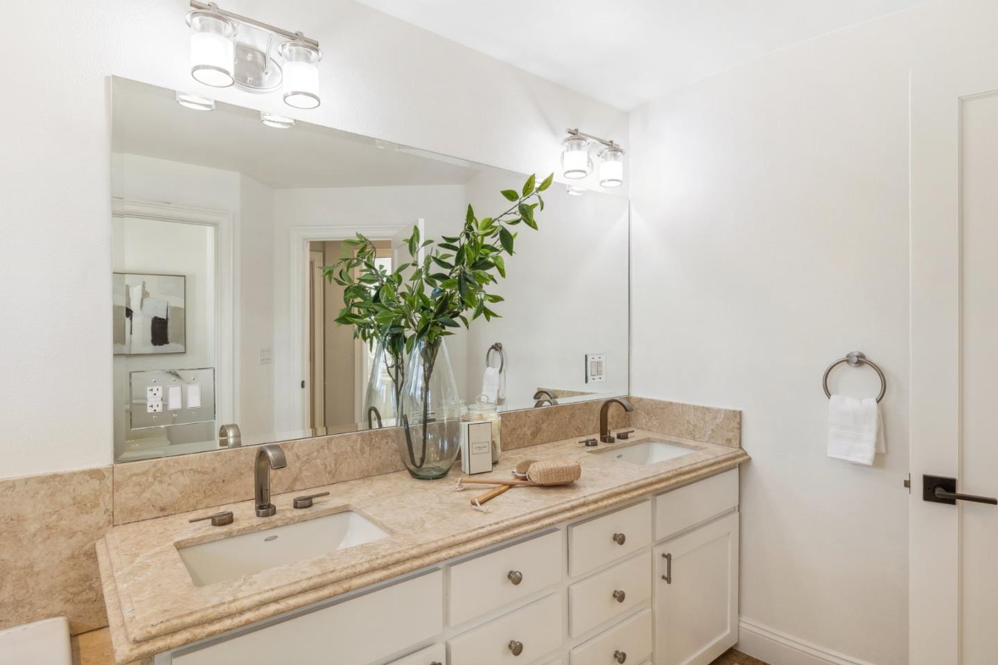 14574 Nelson Way San Jose, CA 95124 - Photo 40 of 62 a bathroom with a double vanity sink and a mirror