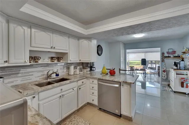 a bathroom with a double vanity sink toilet and shower