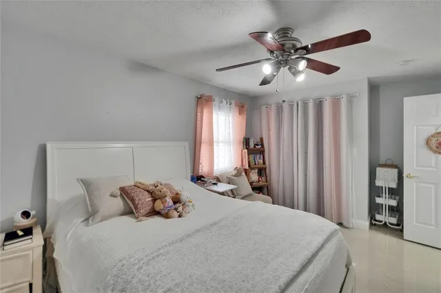 a house view with swimming pool in front of it