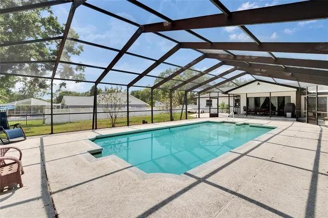 a kitchen with a refrigerator and cabinets