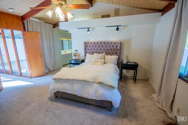 a room with gym equipment and wooden floor