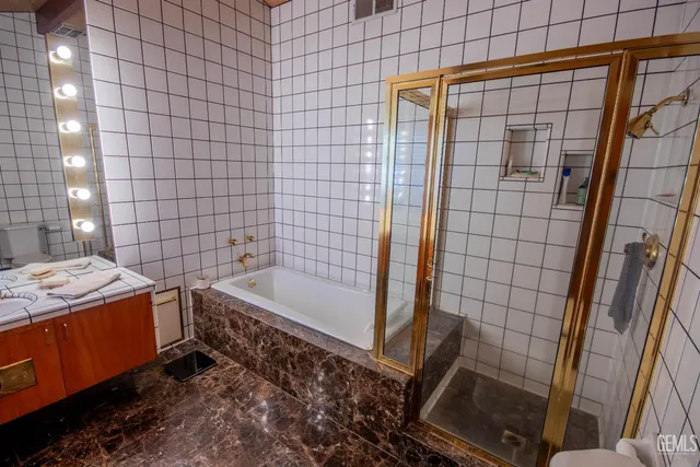 a bed room with a bed and a chair