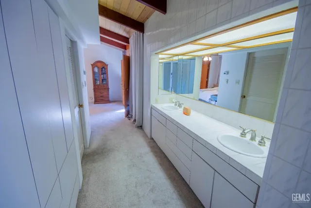 a bedroom with a bed and a desk