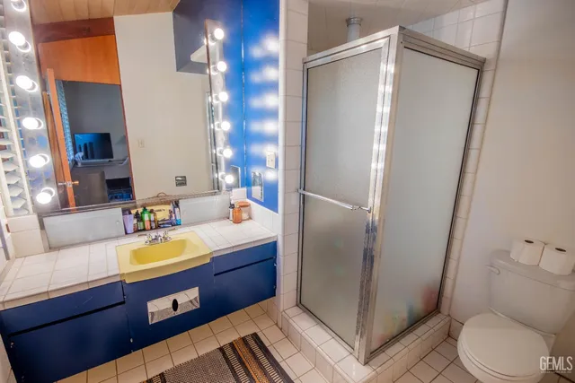 a living room with furniture cabinets and a book shelf