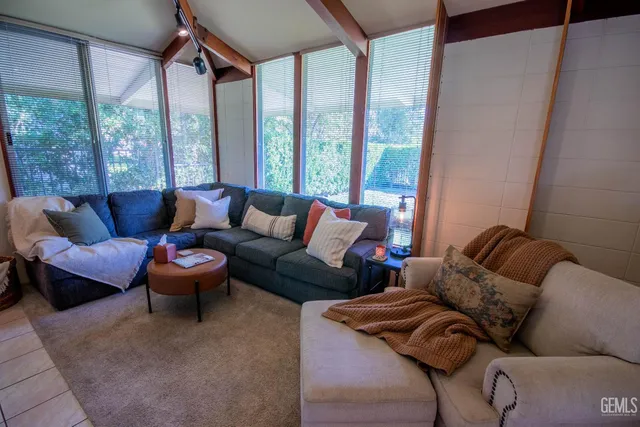 a bathroom with a sink a mirror and a shower