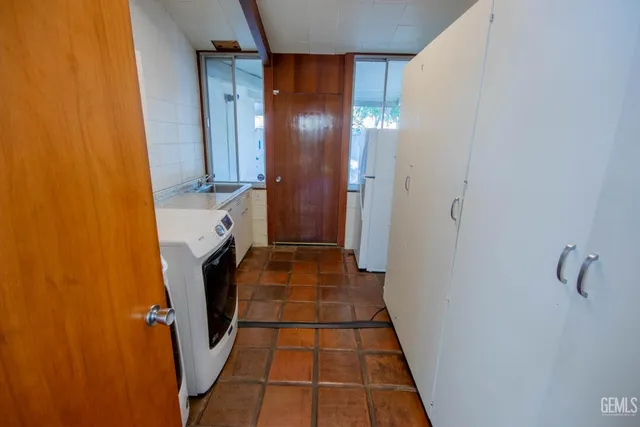 a view of a backyard with sitting area