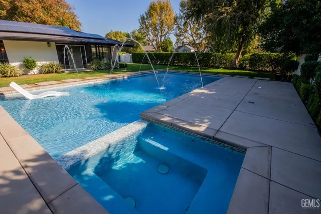 a view of house with a yard