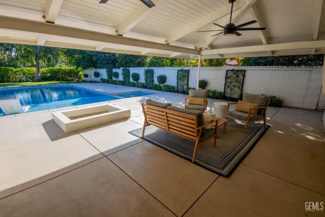 a view of a yard with a house in the background