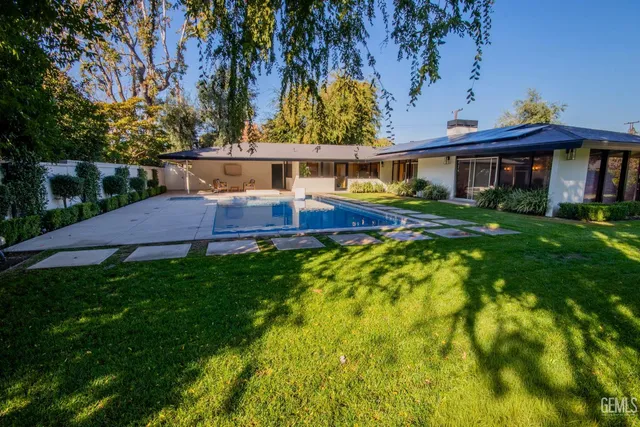 a view of a house with a tree