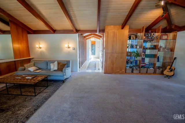 a kitchen with stainless steel appliances a stove a sink and a refrigerator