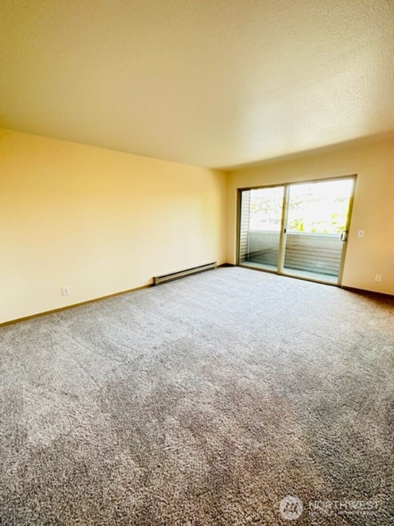 5631 Hwy Place, Unit 8 Everett, WA 98203 - Photo 3 of 11 a view of an empty room with a window