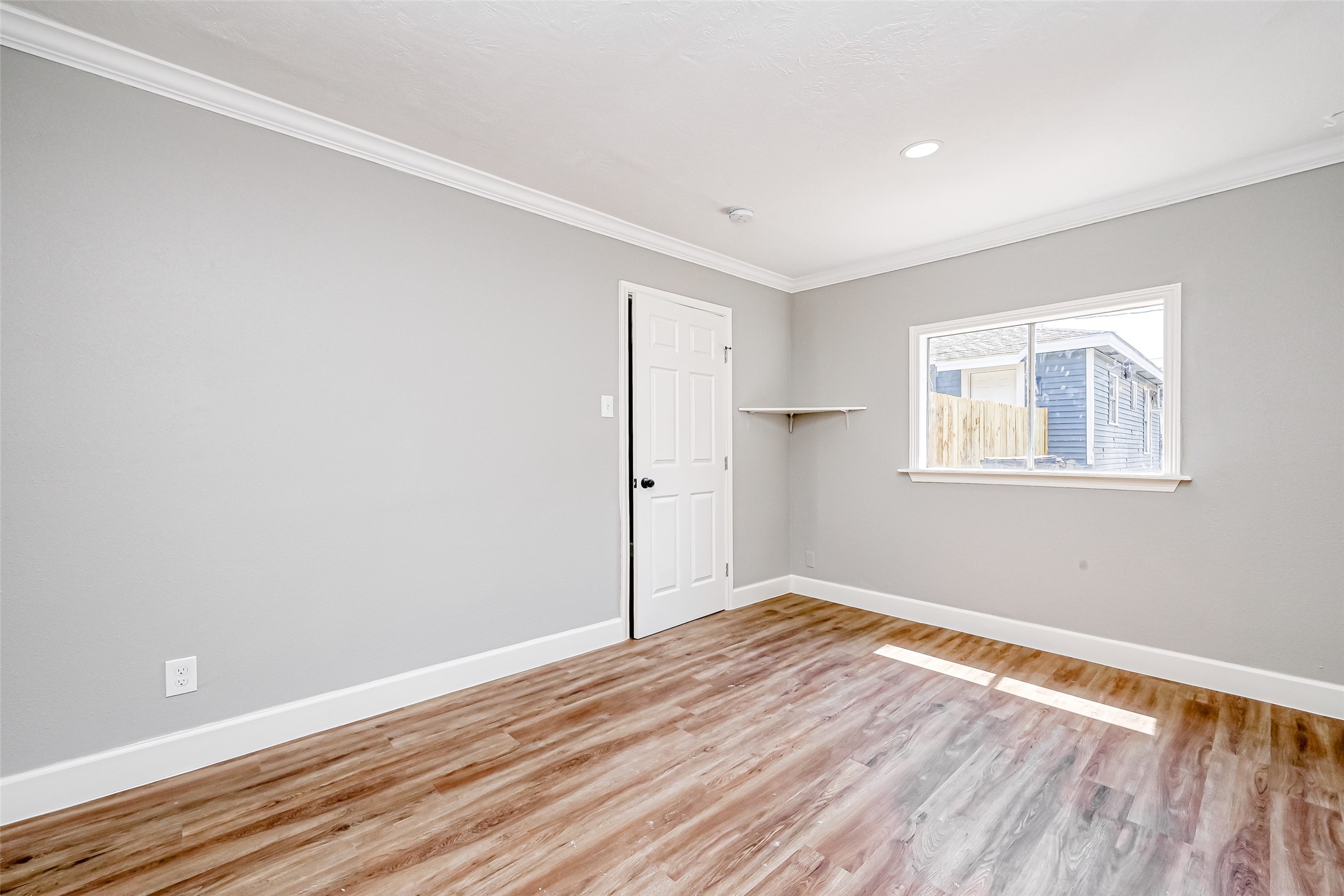 6715 Victoria Street Houston, TX 77020 - Photo 20 of 46 a view of empty room with wooden floor