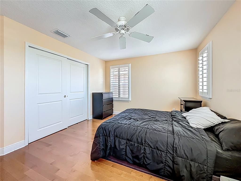 10193 Grand Oak Circle Madeira Beach, FL 33708 - Photo 40 of 67 a bedroom with a bed and window