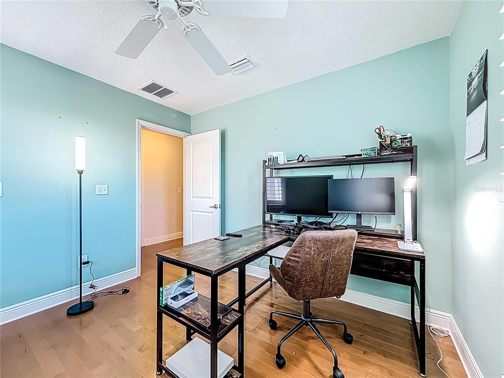 10193 Grand Oak Circle Madeira Beach, FL 33708 - Photo 45 of 67 a workspace with furniture and window