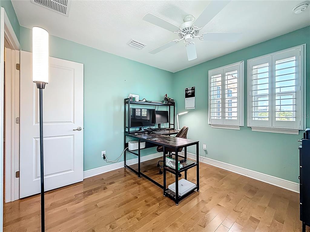 10193 Grand Oak Circle Madeira Beach, FL 33708 - Photo 46 of 67 a workspace with furniture and a window