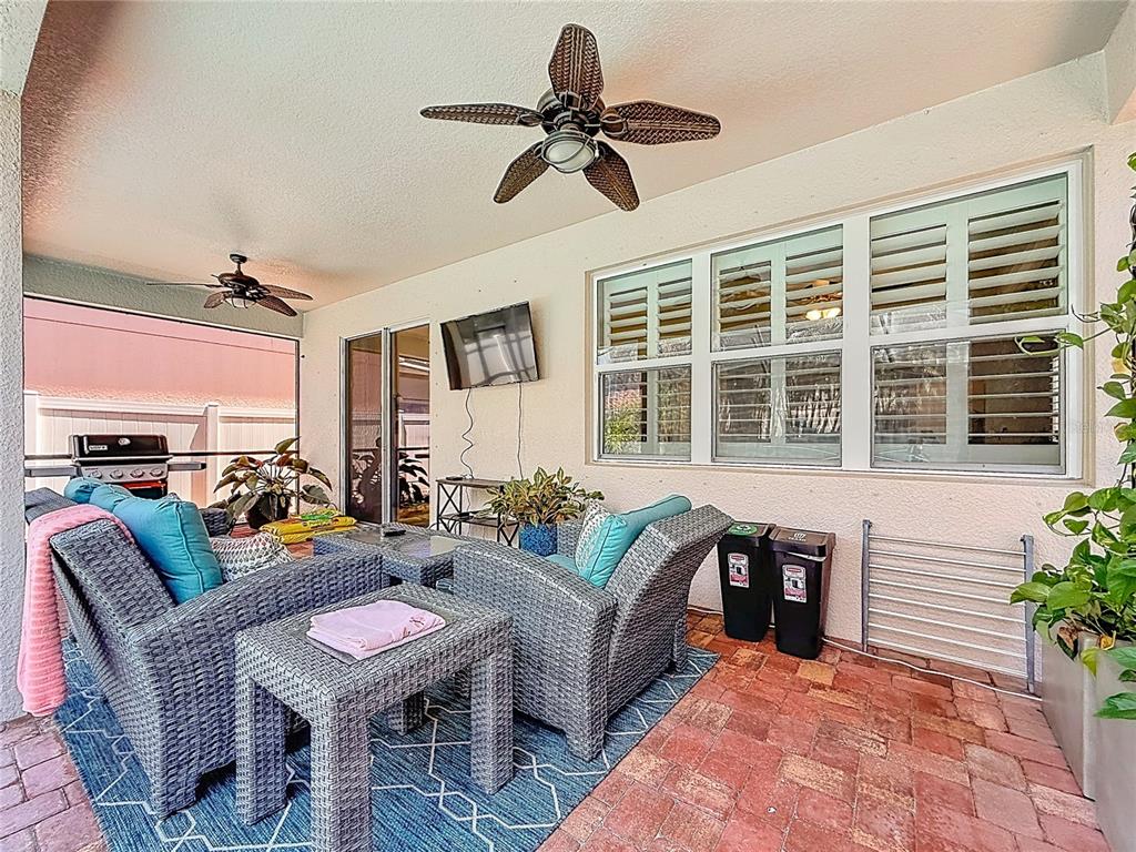 10193 Grand Oak Circle Madeira Beach, FL 33708 - Photo 53 of 67 a living room with furniture and a large window