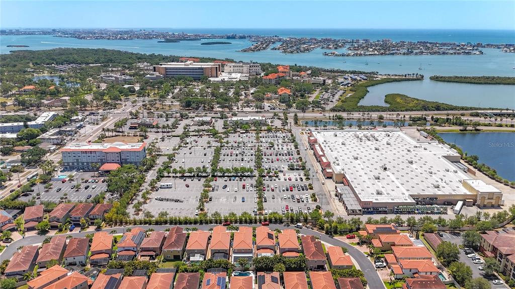 10193 Grand Oak Circle Madeira Beach, FL 33708 - Photo 65 of 67 an aerial view of residential houses with outdoor space