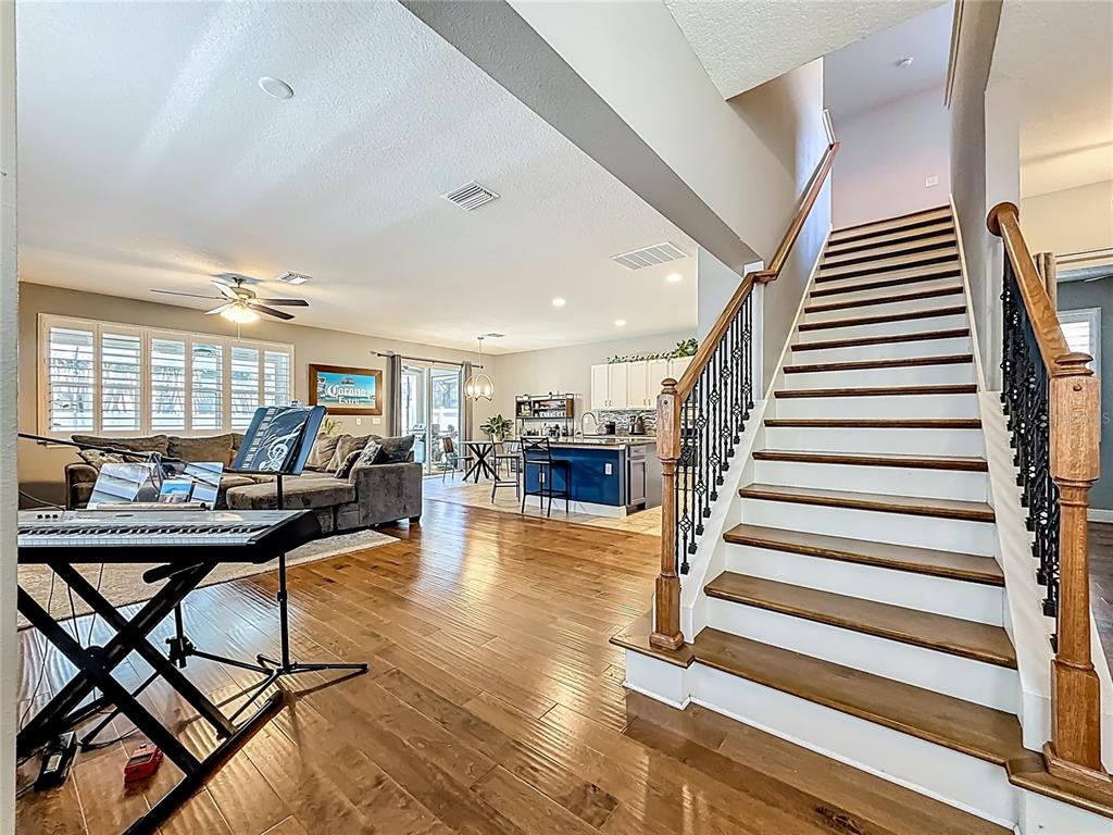 10193 Grand Oak Circle Madeira Beach, FL 33708 - Photo 8 of 67 a view of a livingroom with furniture and wooden floor
