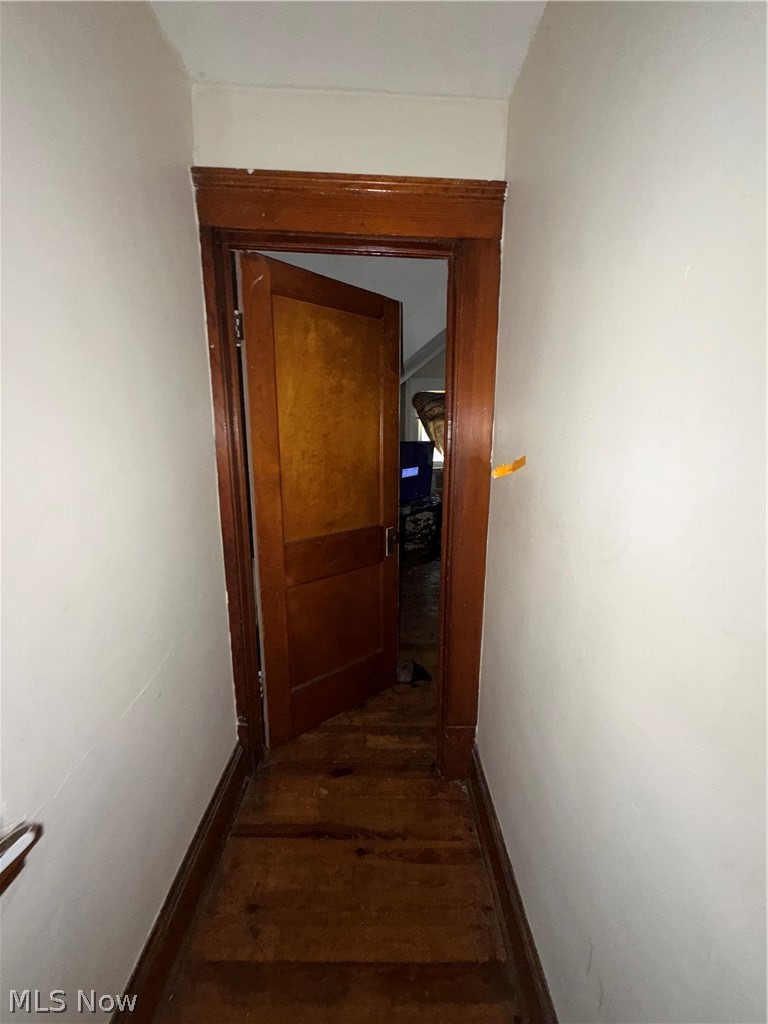 3217 Sycamore Road Cleveland Heights, OH 44118 - Photo 4 of 18 Wood-finish flooring with rich wood trim and a paneled door