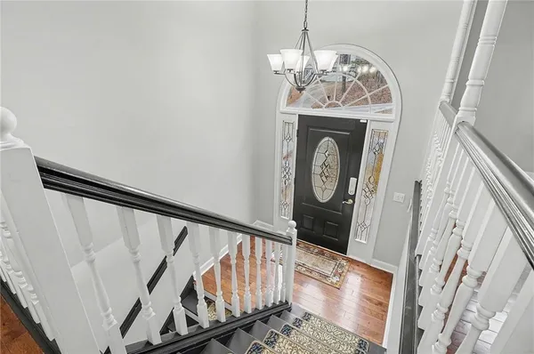 a view of an entryway with wooden floor